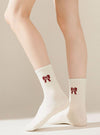 Holiday Bow Socks In 2 Colors